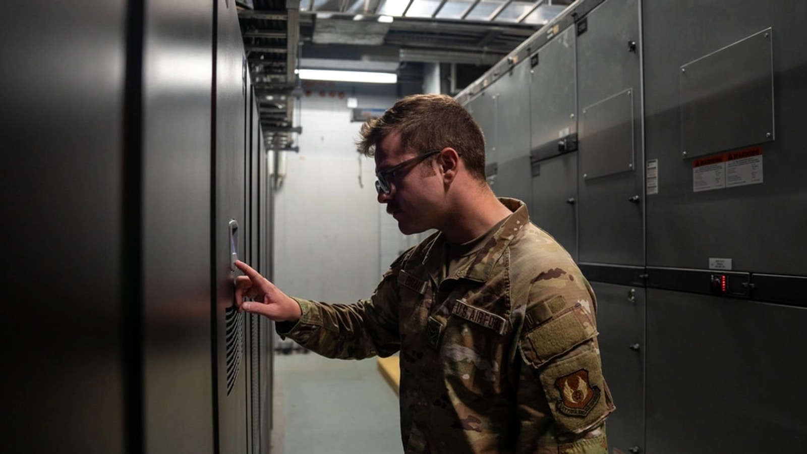 Data center operator checking a critical uninterruptible power supply