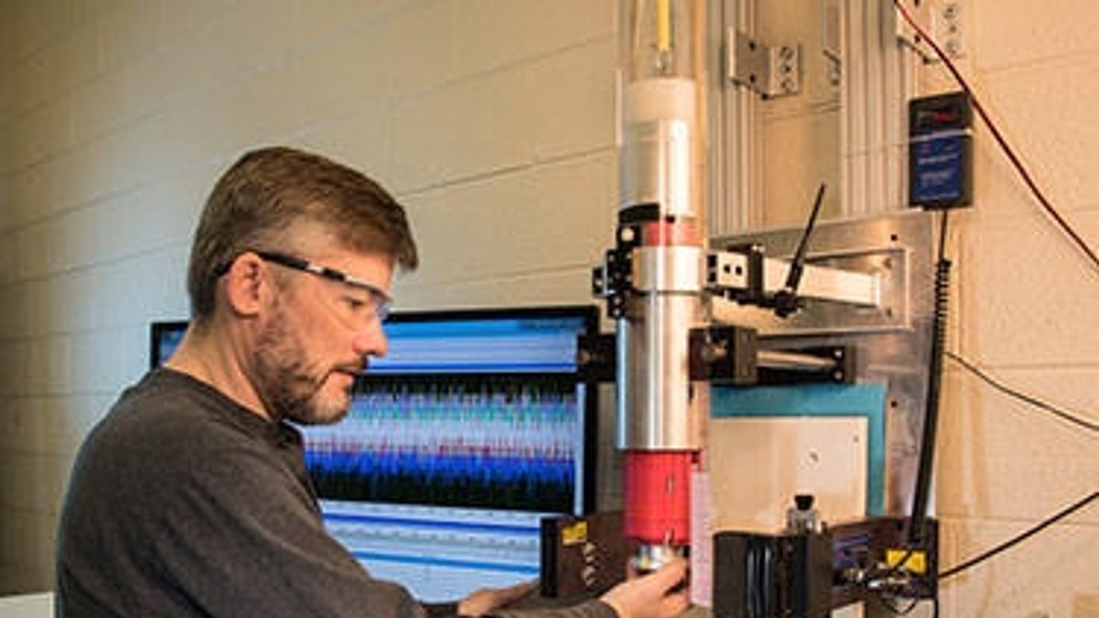 NIST materials scientist preparing a sample for laboratory testing