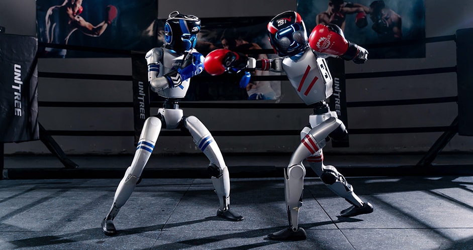 Two Unitree G1 humanoid robots boxing in a ring